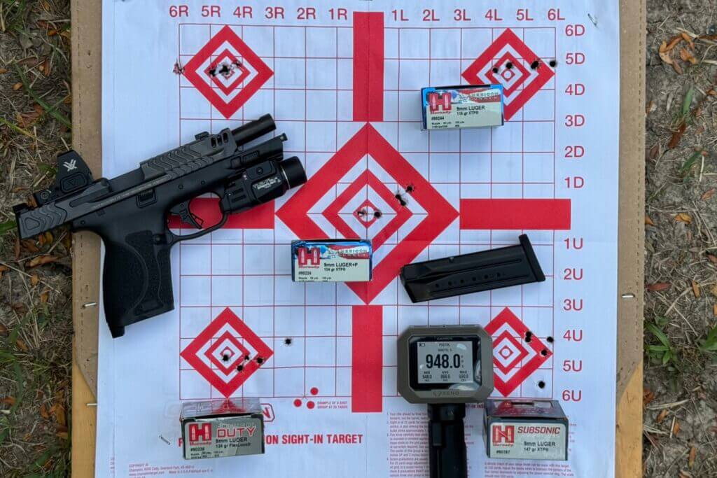 Smith & Wesson M2.0 Carry Comp with paper target and Hornady ammunition boxes