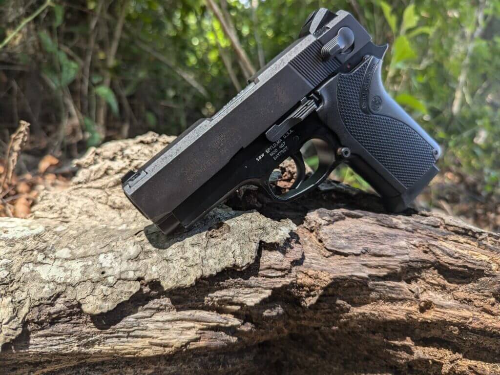 S&W third-generation handgun, the 457 on rugged piece of wood