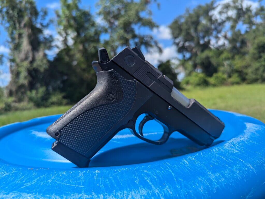 Smith & Wesson gun on blue barrel
