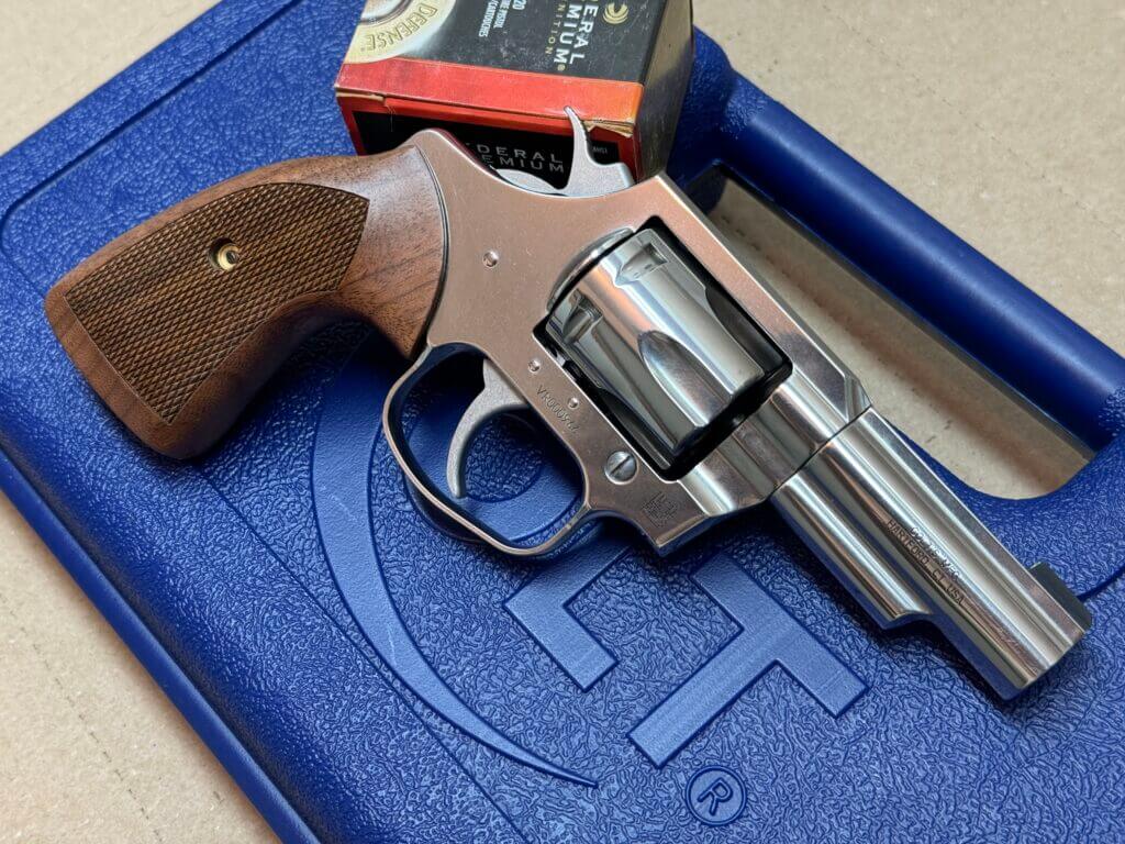 Colt Viper revolver on blue carry case with box of Federal Punch ammo