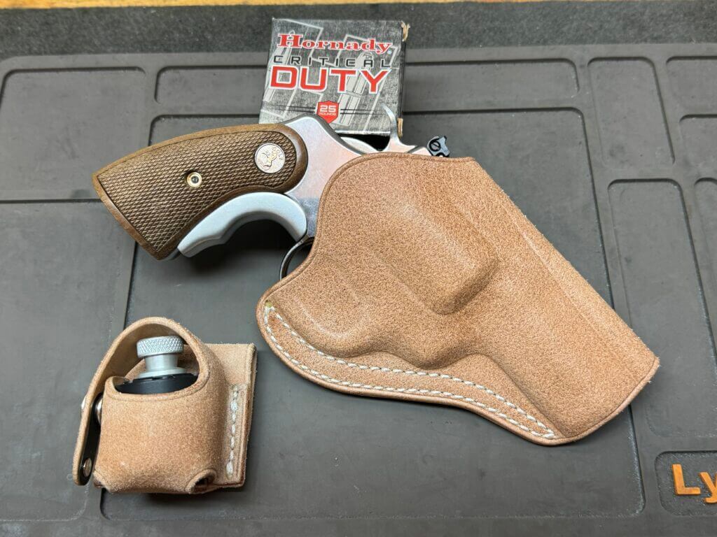 Colt Python revolver with leather holster