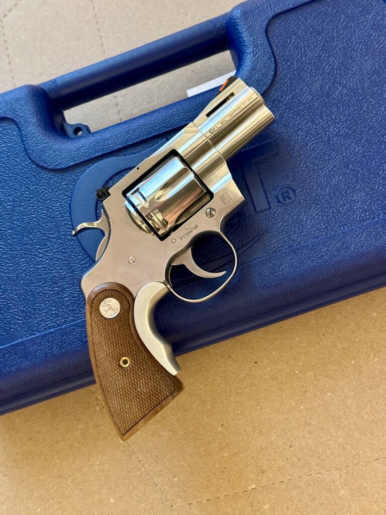 Colt Python revolver right side with case