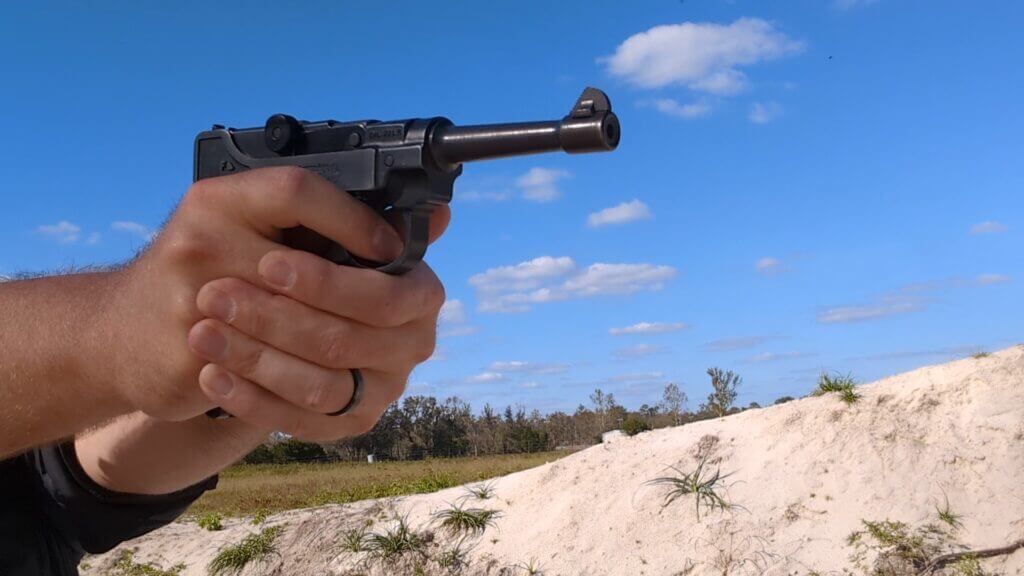 Man aiming the stoeger luger