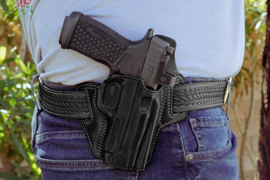 A holstered P365 Fuse on a man's waist.