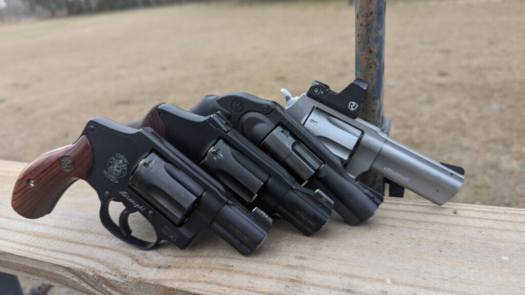 Assorted concealed carry revolver options on table for EDC comparison and selection
