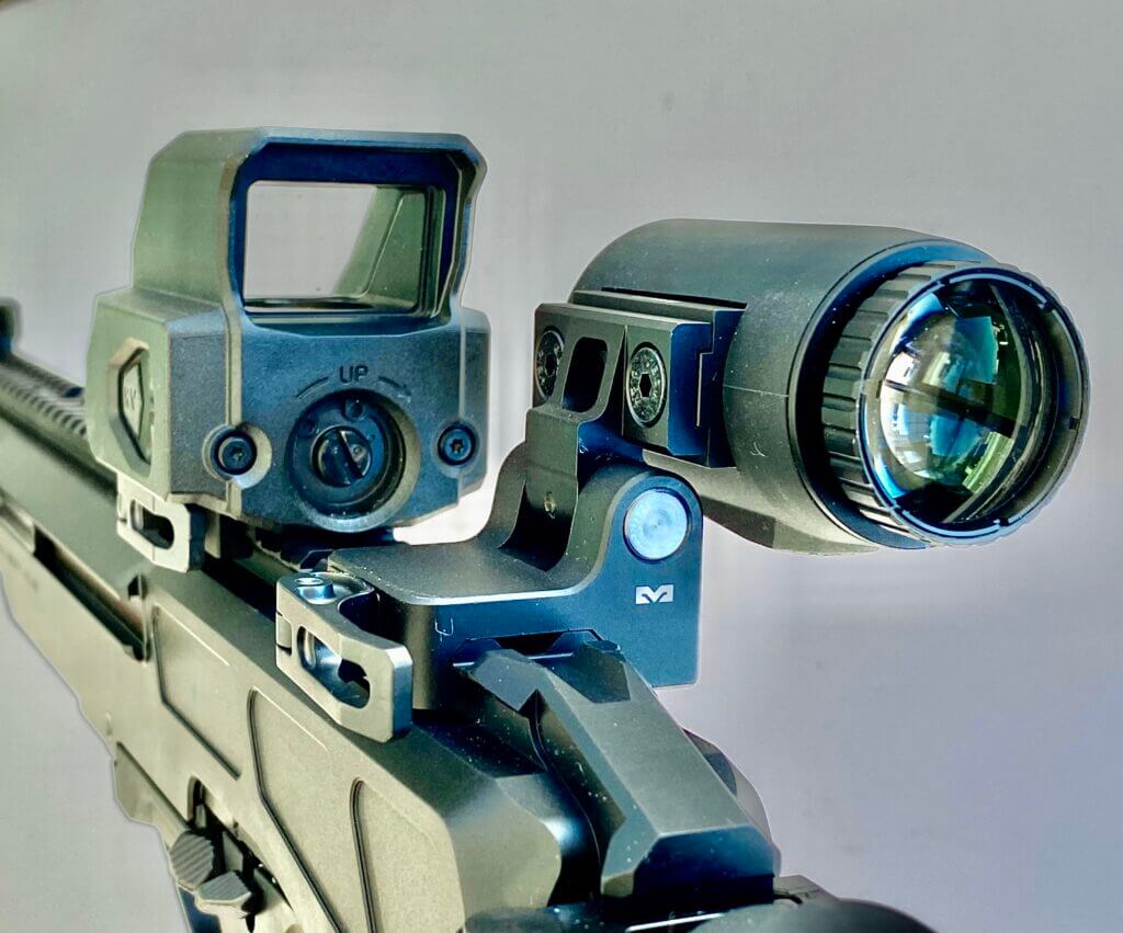 Tru-Vision red dot and Meproguard MMX3 Magnifier mounted to a rifle