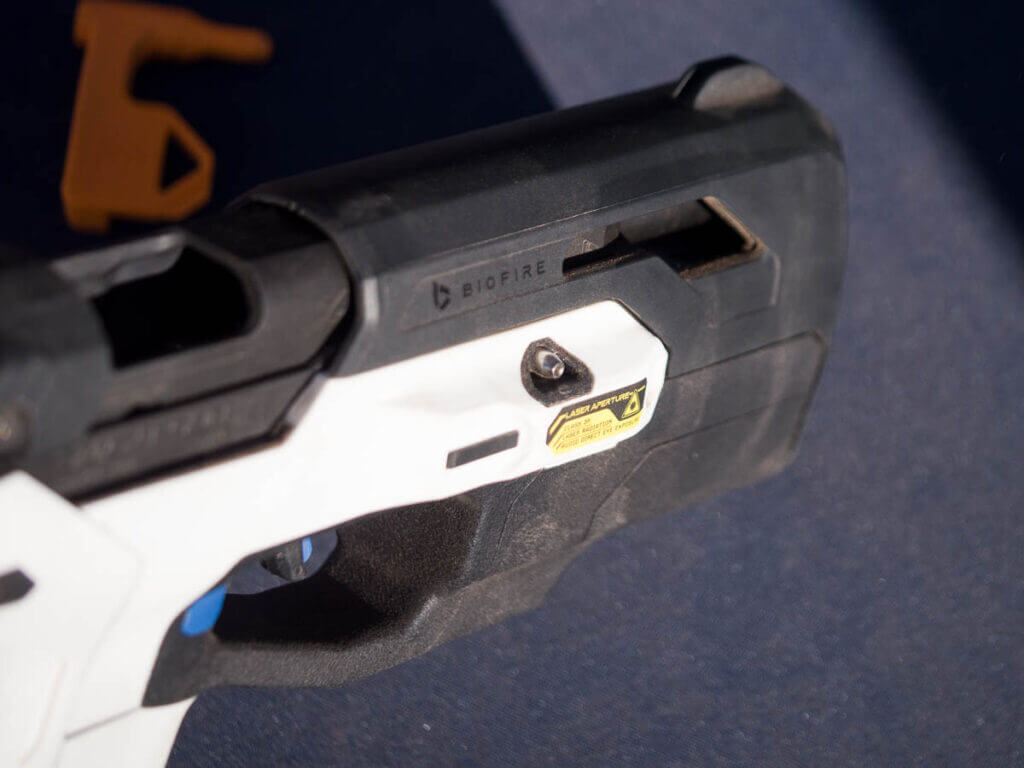 Close up showing the takedown pin on the right side of the gun.