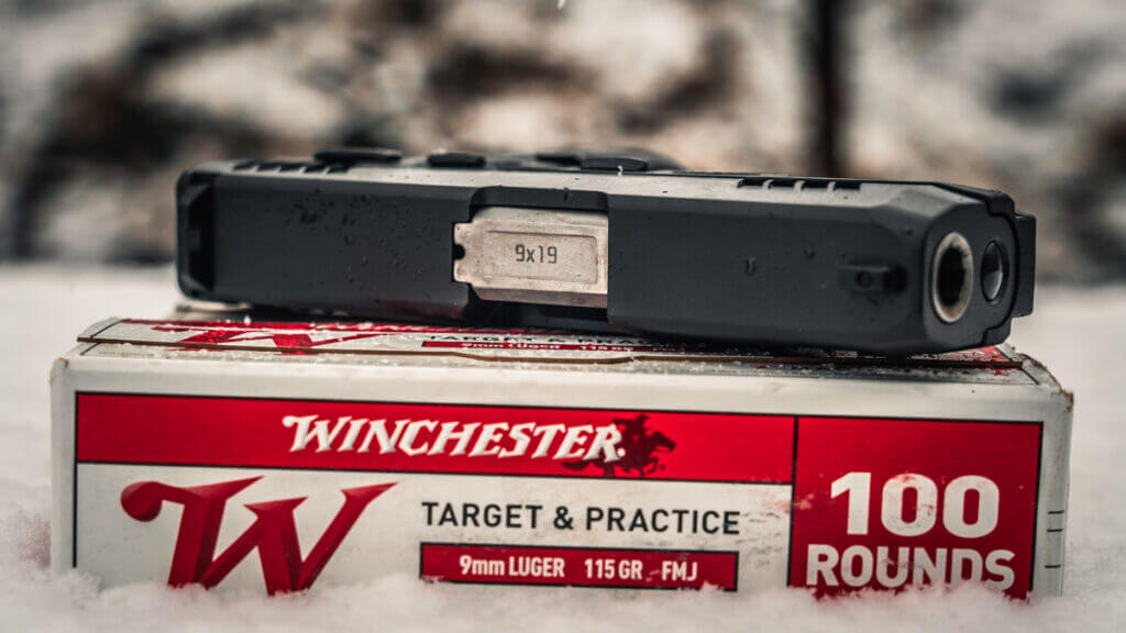 GX2 on top of a box of Winchester Ammunition.