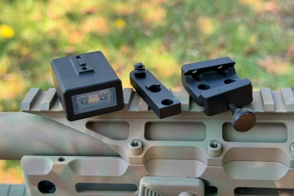 different mounting pieces on a rifle