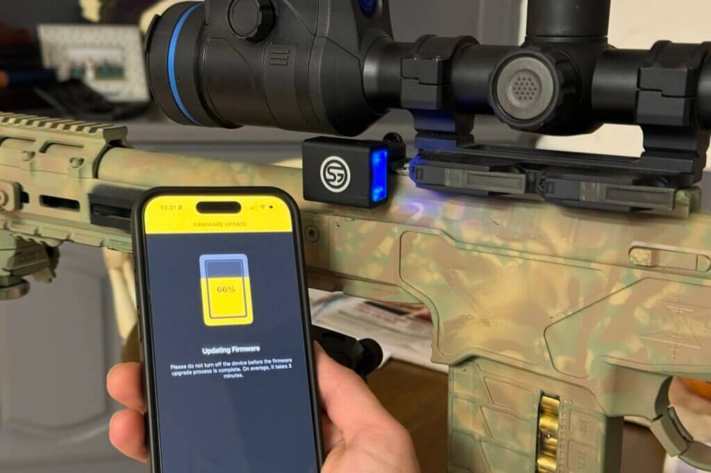 Phone and rifle with scope