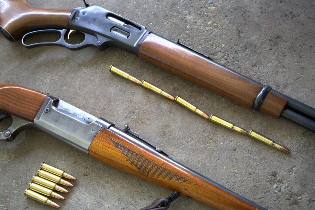 Lever action rifles with nose-tip ammo stacking