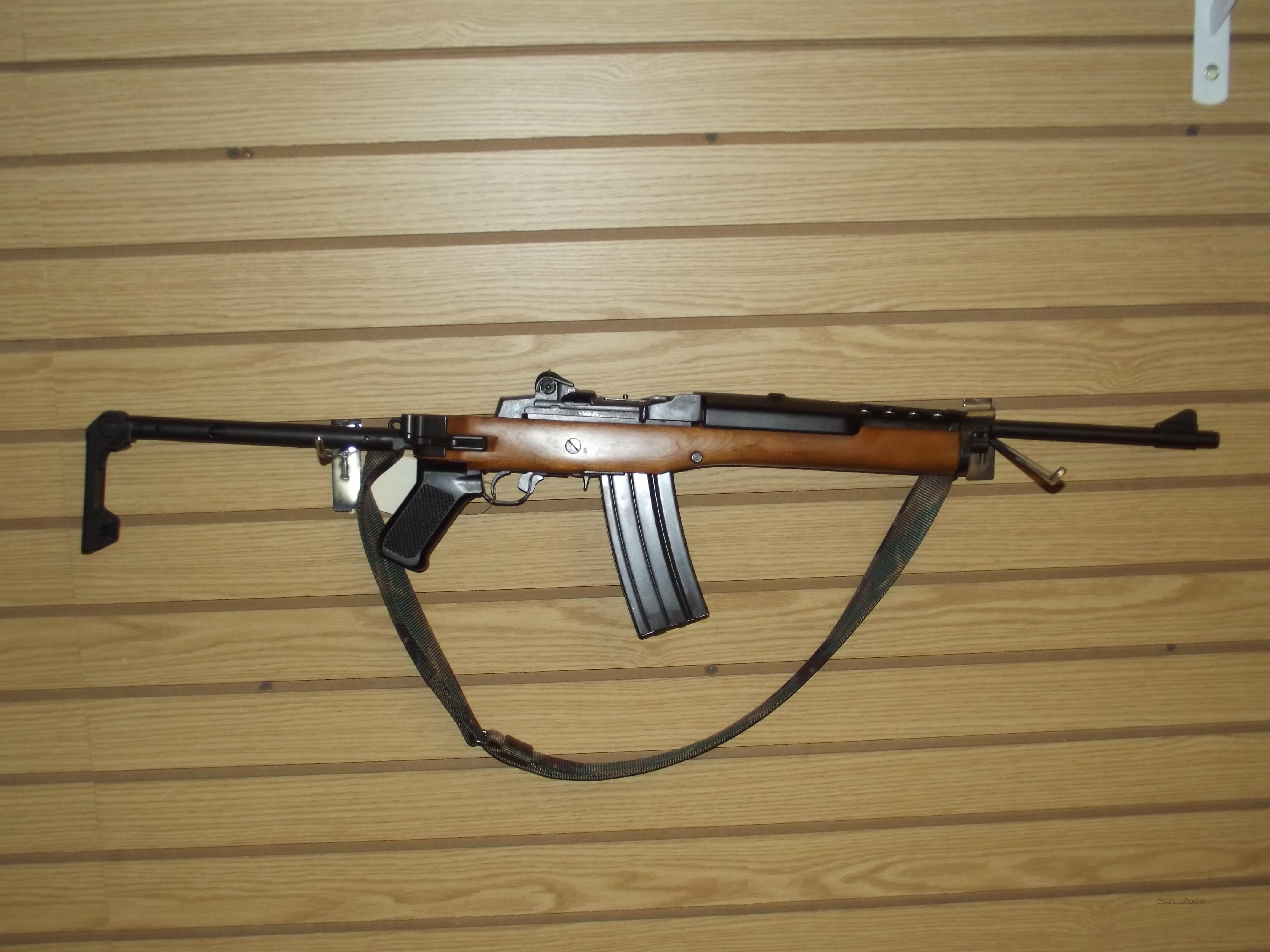 Used ruger MINI-14 factory folder in caliber 223,blued with factory wood fo...